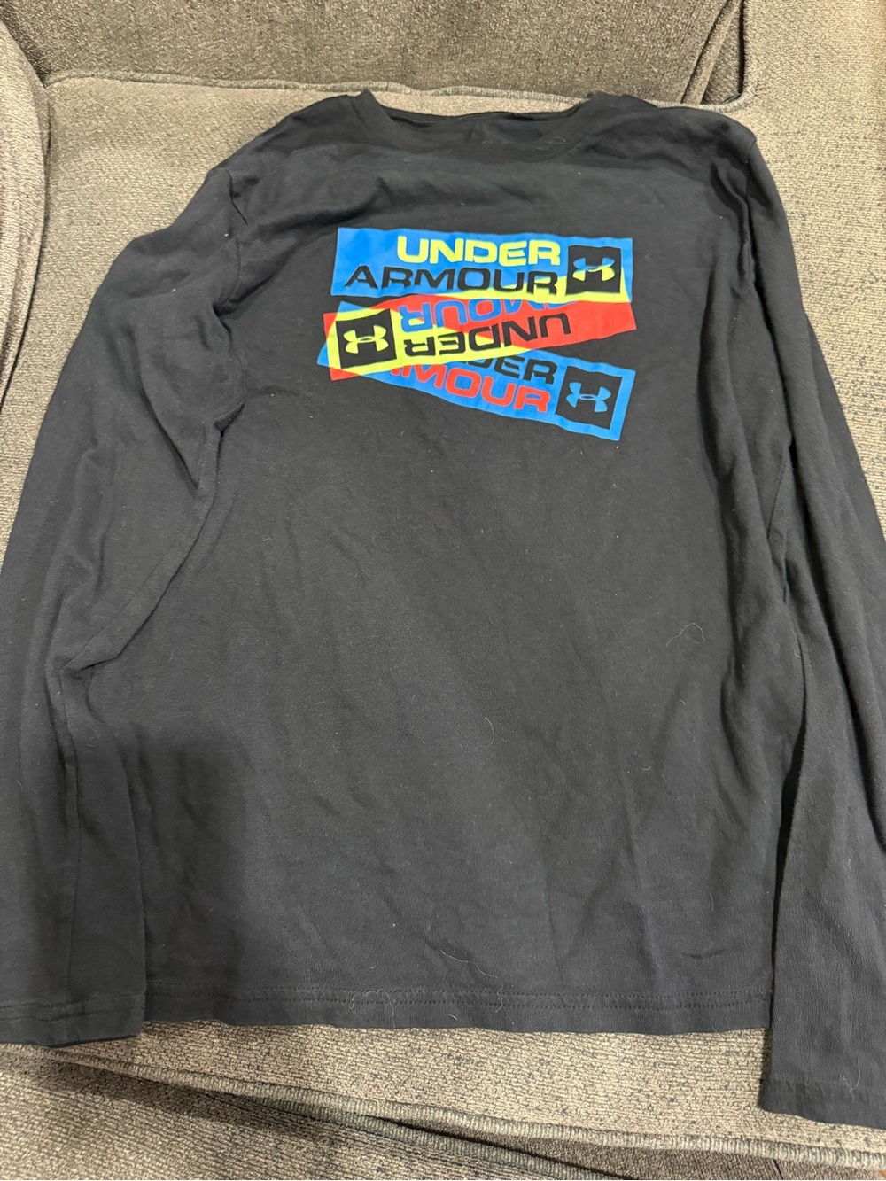 Under Armour Black Long Sleeve Tee with Blue, Red and Yellow Logo